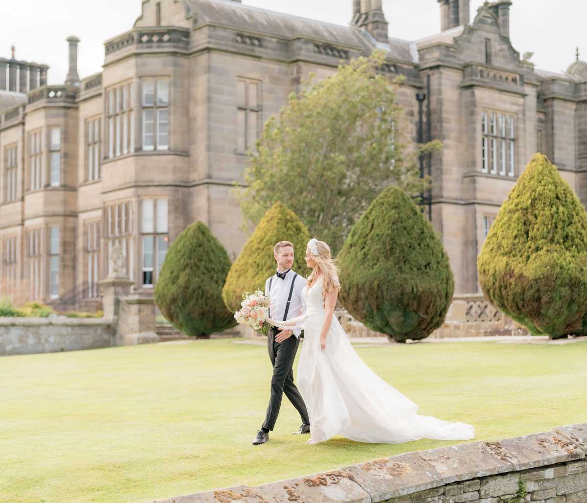 bride and groom on the back lawn